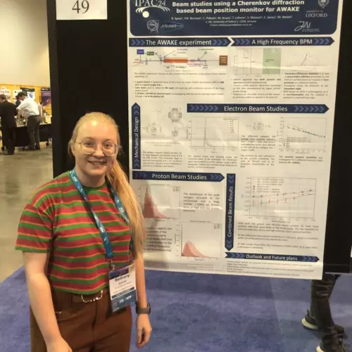 Bethany Spear presenting her poster at IPAC 2024