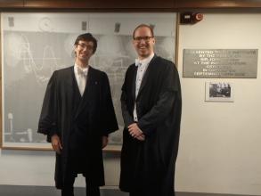 Seb Wilkes and Prof. Adrian Oeftiger standing, smiling in formalwear